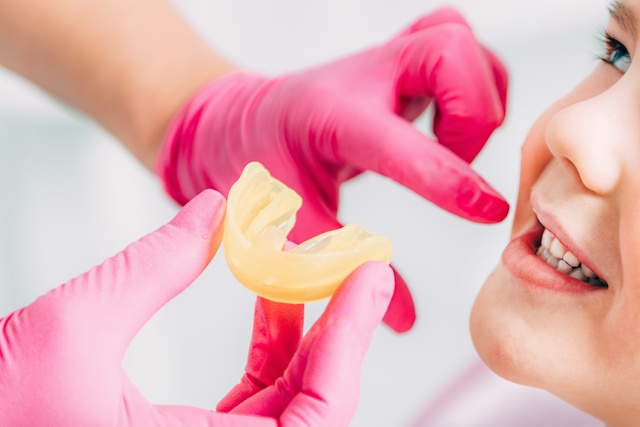Orthodontist working with little boy